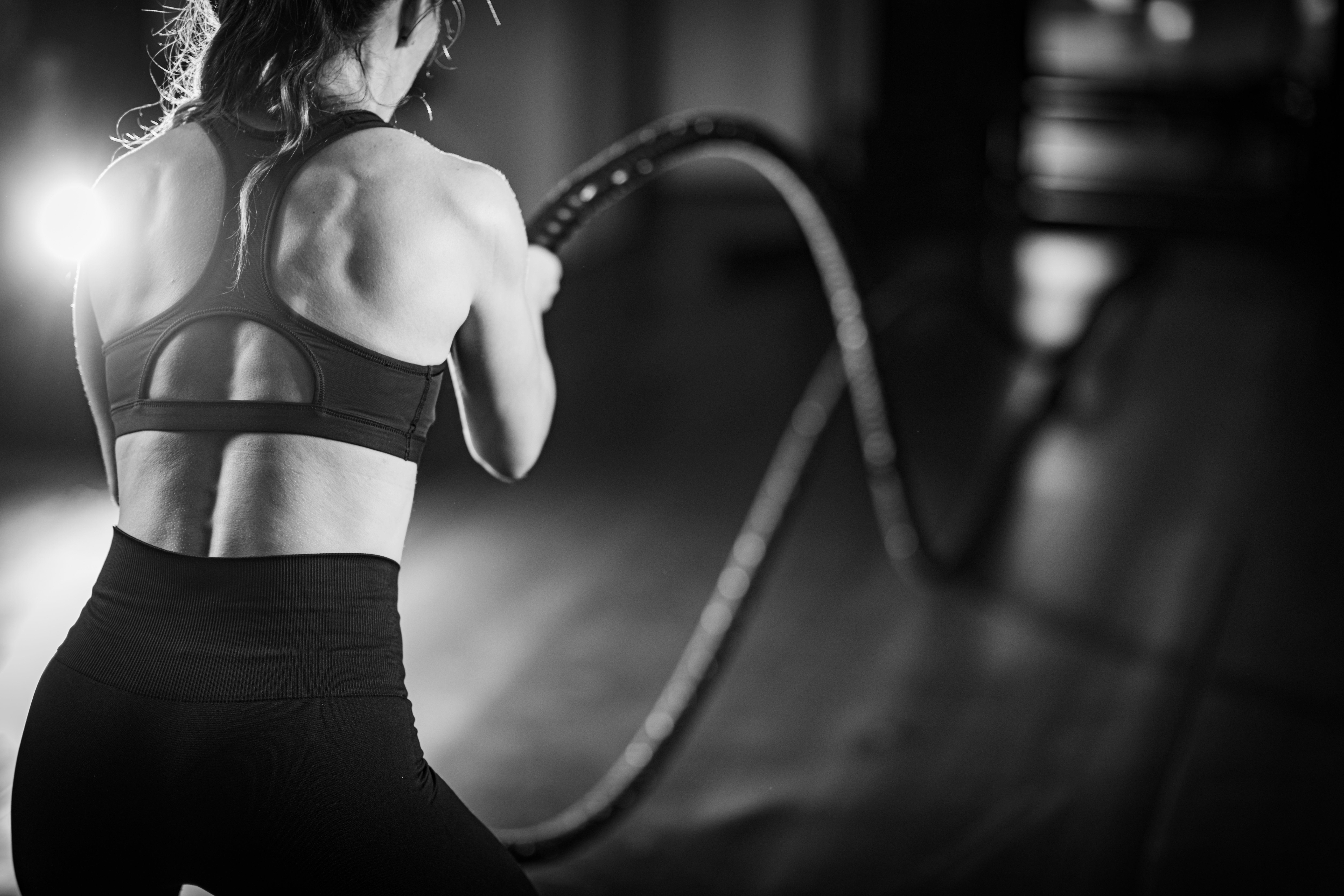 Agility,Training,,Woman,Exercising,With,Rope,In,A,Gym.